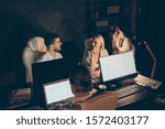 Small photo of Four nice attractive hardworking cheerful people leaders partners top executive managers entrepreneurs developing department solving tech issue meeting deadline at late night work place station