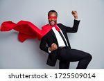 Small photo of Portrait of nice attractive cheerful cheery glad guy rescuer wearing suit hero look mask celebrating accomplishment air wind blow fly isolated over grey pastel color background