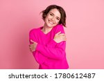 Small photo of Photo of overjoyed lady good mood hands hug herself shoulders enjoy joyful soft cloth laundry warmth toothy smile wear casual bright sweater isolated pink pastel color background