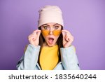 Close up photo of astonished girl see unbelievable novelty stare, stupor impressed shout wow omg wear good look outfit isolated over purple color background