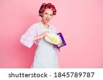 Photo of aggressive mad housewife hold grate cabbage wear purple bathrobe dotted apron isolated on pink color background