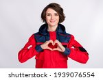 Photo of young woman paramedic happy smile showing fingers heart symbol cardiac isolated over white color background
