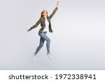 Full size portrait of charming glad person raise arm reach look empty space isolated on grey color background