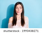 Photo of hungry excited young woman look empty space imagine yummy food isolated on blue color background