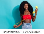 Small photo of Photo portrait of girl in top unhappy angry looking at telephone wrong number balloon isolated vivid blue color background