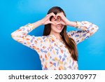 Photo of sweet adorable young lady wear print shirt smiling showing hands arms heart close eye isolated blue color background