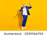 Full size photo of funny grey beard old man dance wear spectacles blue jacket isolated on yellow background