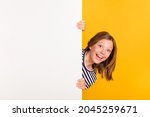 Portrait of small astonished lady open mouth unexpected promotion touch empty space wall isolated on yellow color background