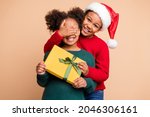 Photo of two funny kids boy make surprise cover girl eyes wear x-mas hat jumper isolated beige color background
