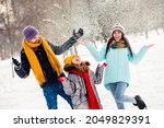 Photo of cheerful family happy positive smile have fun enjoy time together playful fly air snow walk park
