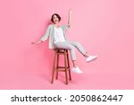 Full length photo of funny bob hairdo millennial lady sit dance wear grey green look isolated on pink background