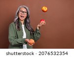 Small photo of Photo of impressed old grey hairdo lady juggle wear shirt eyesight isolated on brown color background