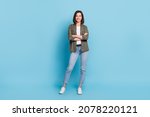 Small photo of Full body photo of cool satisfied glad lady stand with folded arms wear khaki clothes isolated over sky light color background