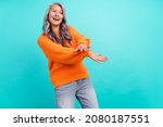 Small photo of Photo of mature woman good mood discotheque clubber festive isolated over turquoise color background