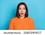 Portrait of attractive amazed girl sudden incredible news reaction wow isolated over bright blue color background