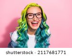 Portrait of attractive cheerful wavy-haired girl laughing hilarious joke good mood isolated over pink pastel color background