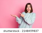 Small photo of Photo of young excited girl indicate finger product offer discount select isolated over pink color background
