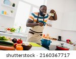 Small photo of Photo of young cheerful guy good mood cooking dinner taste yummy fresh soup cuisine culinary indoors