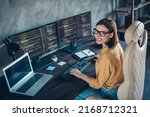 Small photo of Profile side view portrait of attractive cheerful girl geek providing service cyber security at workplace workstation indoors