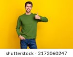 Photo of sweet pretty guy dressed green pullover showing thumb up empty space isolated yellow color background