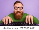 Small photo of Portrait of young geek nerd in spectacles writing code making new html application isolated on violet color background