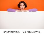 Portrait of impressed lady pouted lips look camera unbelievable offer isolated on orange color background