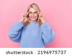 Photo of nice senior blond lady wear eyewear blue sweater isolated on pink color background