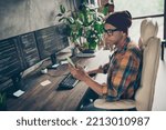Profile photo of smart professional web designer sit chair use telephone instagram twitter facebook telegram workstation office indoors