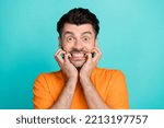 Small photo of Closeup photo of young handsome attractive bearded man wear stylish orange t-shirt gnaw bite nails nervous isolated on aquamarine color background