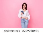 Photo of pretty lovely lady use telephone enjoy remote distance work education stylish wear empty space isolated on pink color background