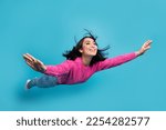 Full length photo of pretty adorable lady wear pink pullover arms sides falling air isolated blue color background