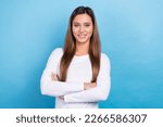 Small photo of Photo of positive glad lovely lady office manger wear white trendy clothes arm folded isolated on blue color background