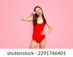 Small photo of Party mood Portrait of foolish playful girl gesturing v-sign near winking eye showing tongue out looking at camera isolated on vivid yellow background
