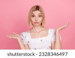 Small photo of Portrait of young funny girl blonde short hair shrug shoulders dilemma staring you dont know her password isolated on pink color background