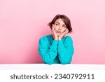 Small photo of Portrait of minded lovely lady wear stylish clothes looking empty space hmm dilemma isolated on pink color background