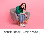 Full length photo of unhappy tired lady wear green shirt sitting chair feeling exhasted isolated pink color background