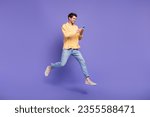 Small photo of Full length size body photo of jumping funky guy browsing new modern smartphone social media marketer isolated on violet color background