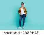 Small photo of Full size photo of charming grandmother hands pockets defile posing wear trendy plaid yellow outfit isolated on cyan color background