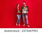 Full body photo of impressed overjoyed people hold pile stack x-mas time giftbox isolated on red color background