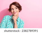 Small photo of Portrait of gorgeous minded person hand touch chin look interested empty space isolated on pink color background