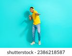 Full body photo of young guy enjoy his itunes playlist music wireless earphones dancing cool party isolated on aquamarine color background