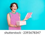Photo of astonished funky young woman brown bob hair open her iphone box surprise for valentine day isolated on aquamarine color background