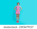 Full length photo of astonished cute girl wear trendy plaid dress impressed good news information isolated on cyan color background