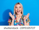 Portrait of impressed crazy girl wear stylish shirt astonished staring at unbelievable discount isolated on vivid blue color background