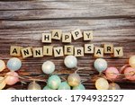 Happy Anniversary alphabet letter with LED Cotton ball Decoration on wooden background