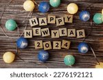 Small photo of Happy New Year 2024 decorate with LED cotton ball on wooden background