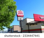 Small photo of Renovated Taco Johns Restaurant - Standalone sign, text reads "Lets get saucy" (Loveland, Colorado, USA) - 06\20\2022