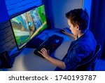 Small photo of Teenage boy playes videogames. Addicted to video gaming at home