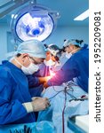 Small photo of Doctors in modern operating room. Medical devices for neurosurgery. Background. Operating theatre. Selective focus.