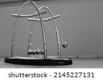 Small photo of Newton's cradle or pendulum with 5 balls
